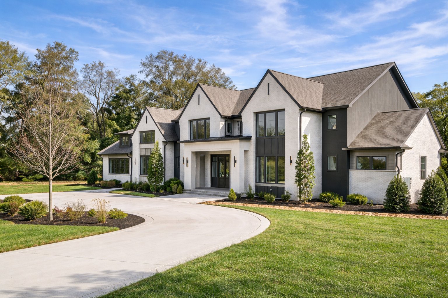 A white East Texas home with a landscaped lawn