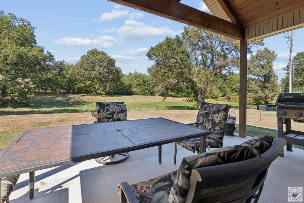 Covered outdoor sitting area at 1100 N FM 992