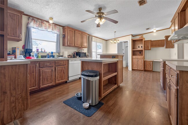 Kitchen with island and wood cabinets at 350 County Road 3102
